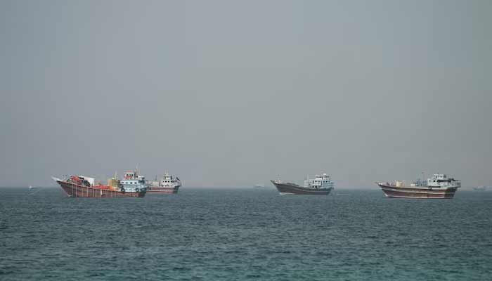 Ships in the Strait of Hormuz, seen from Musandam, Oman, June 25, 2026. — Reuters/File