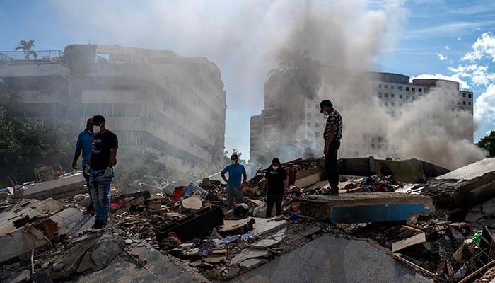 Rescuers and volunteers search for survivors in La Guaira, La Guaira state, Venezuela, June 28, 2026, following two earthquakes. -AFP