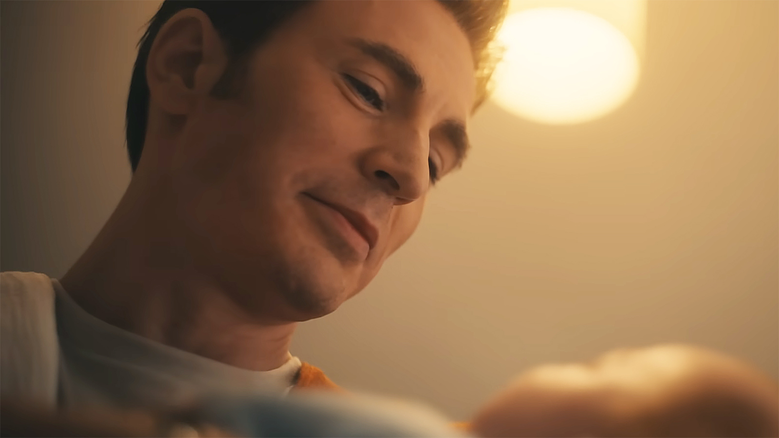 Steve Rogers smiles as he looks at his newborn son in Avengers: Doomsday