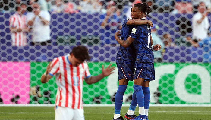 Frances Michael Olise and Kylian Mbappe celebrate after the match. -Reuters