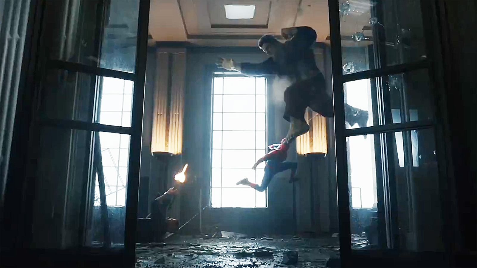 The Punisher lies on the ground as he shoots a flying Hulk, which Spider-Man jumps onto, in Spider-Man: Brand New Day
