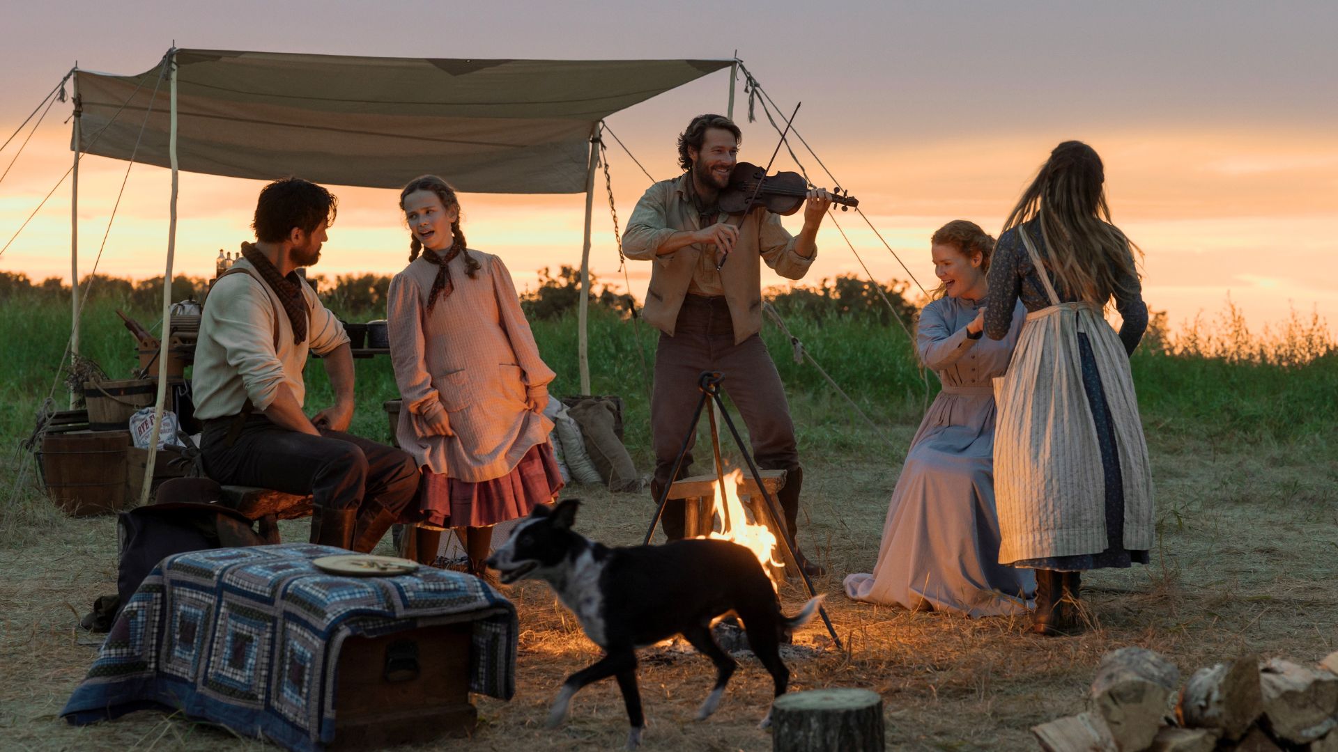 The Ingalls family dances while Charles plays the violin