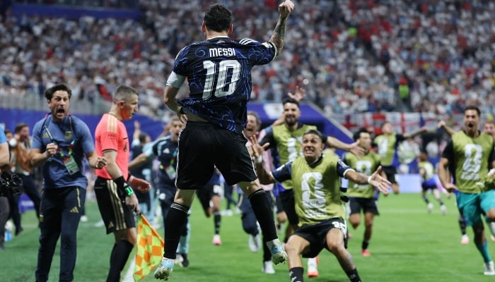 Argentine striker No. 10 Lionel Messi celebrates after winning the 2026 FIFA World Cup semi-final between England and Argentina at Atlanta Stadium in Atlanta, July 15, 2026. — AFP