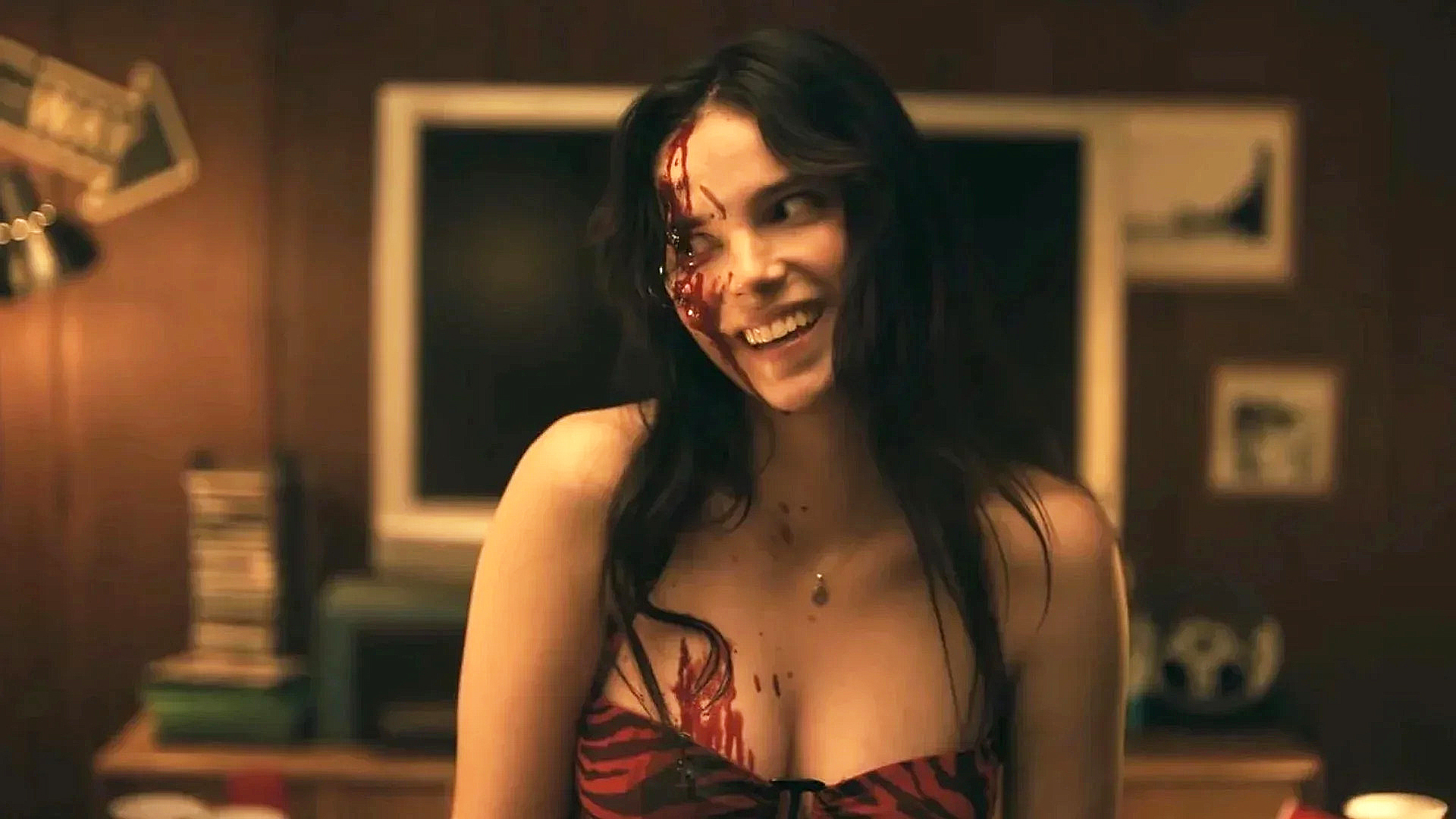 A bloodied Nikki with a disturbing smile on her face in Obsession