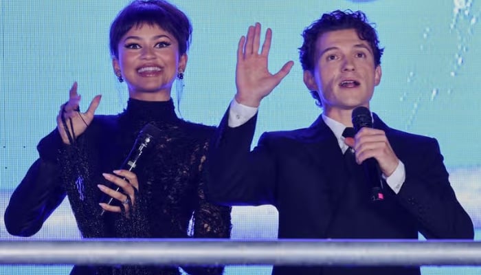 Tom Holland Can't Take His Eyes Off Zendaya At Spider-Man Event