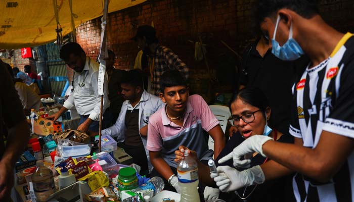 A makeshift medical camp formed to treat supporters of India's Cockroach Janata Party (CJP) during ongoing protests, two days after thousands of protesters marched to Parliament demanding the resignation of Education Minister Dharmendra Pradhan over leaked exam papers, at Jantar Mantar in New Delhi, India, July 22, 2026. — Reuters
