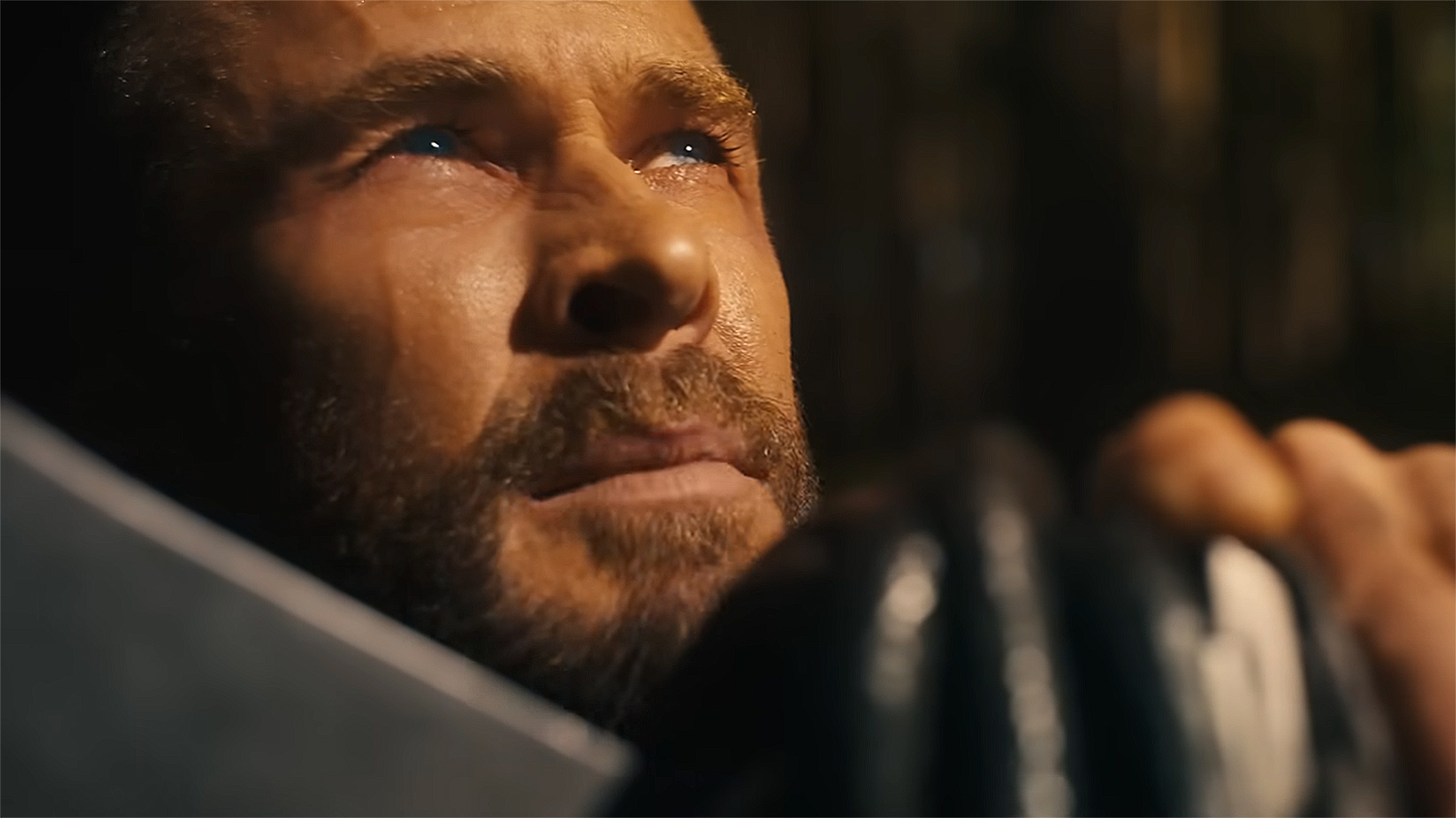 Thor looking at the sky with his right hand on Stormbreaker in Avengers: Doomsday