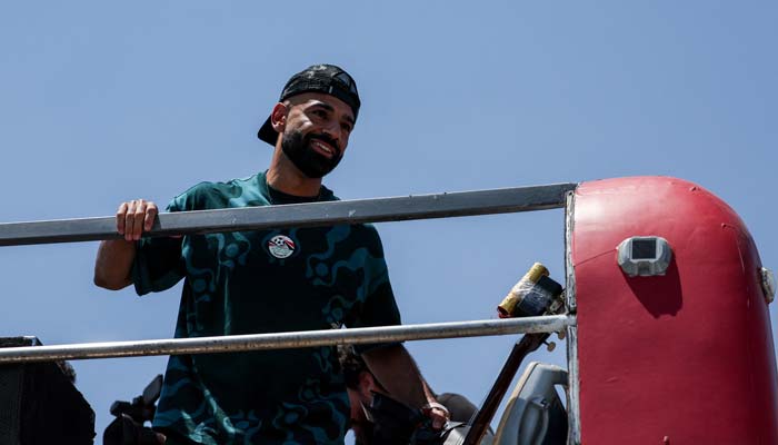 Egypt's Mohamed Salah watches the crowd from a bus as the Egyptian national team is welcomed by fans at El Alamein International Airport upon their return from the 2026 FIFA World Cup, ahead of an official reception by President Abdel Fattah al-Sisi, in El Dabaa, Egypt, July 10, 2026. — Reuters