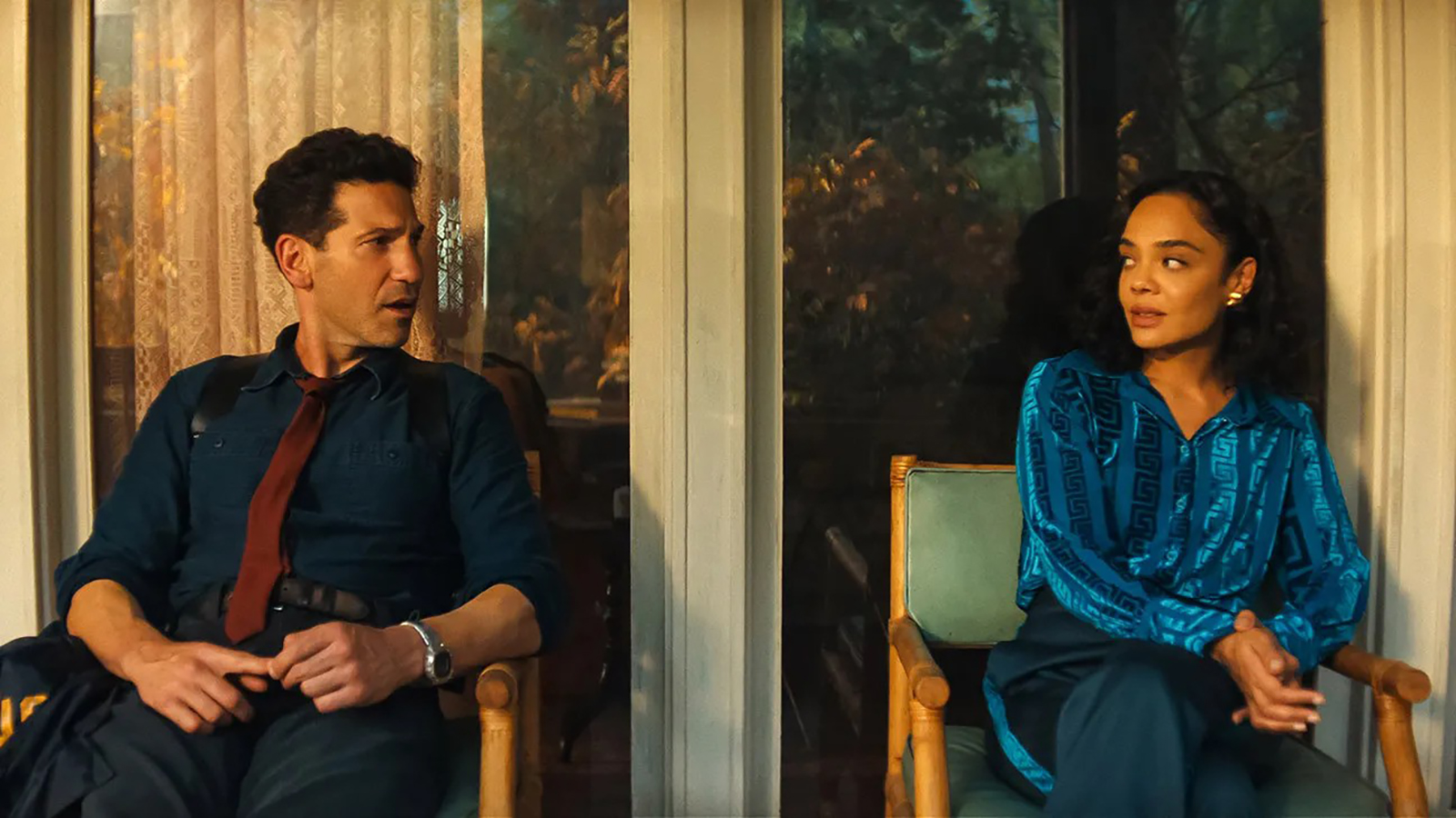 Jack and Anna look at each other as they sit in his & Hers on Netflix