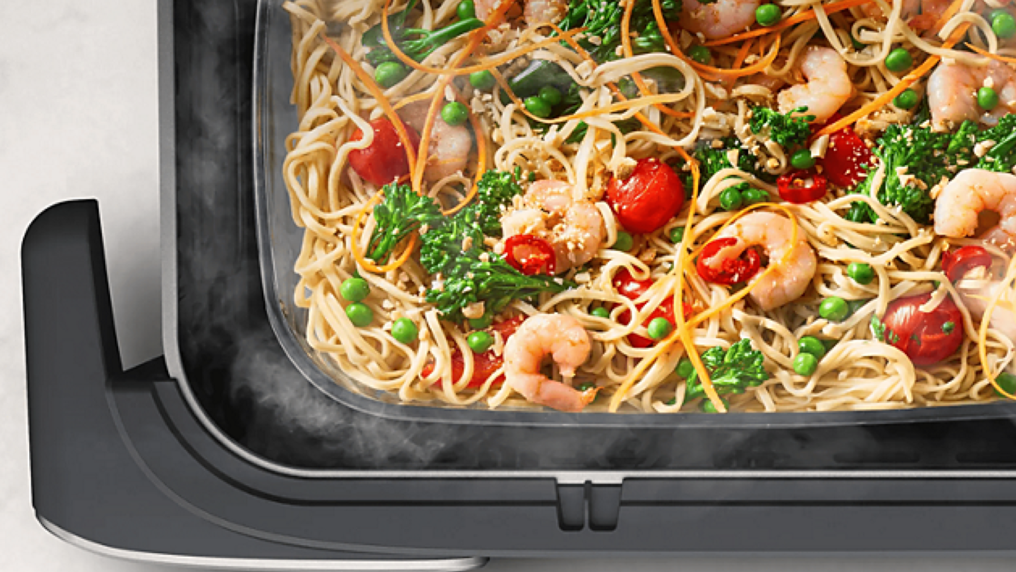 Product photo of the Philips Airfryer 5000 Series Megabasket with steam top view showing steamed food